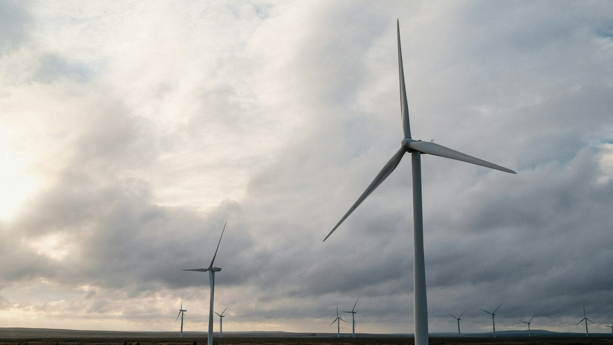 Wind turbines under the grey sky