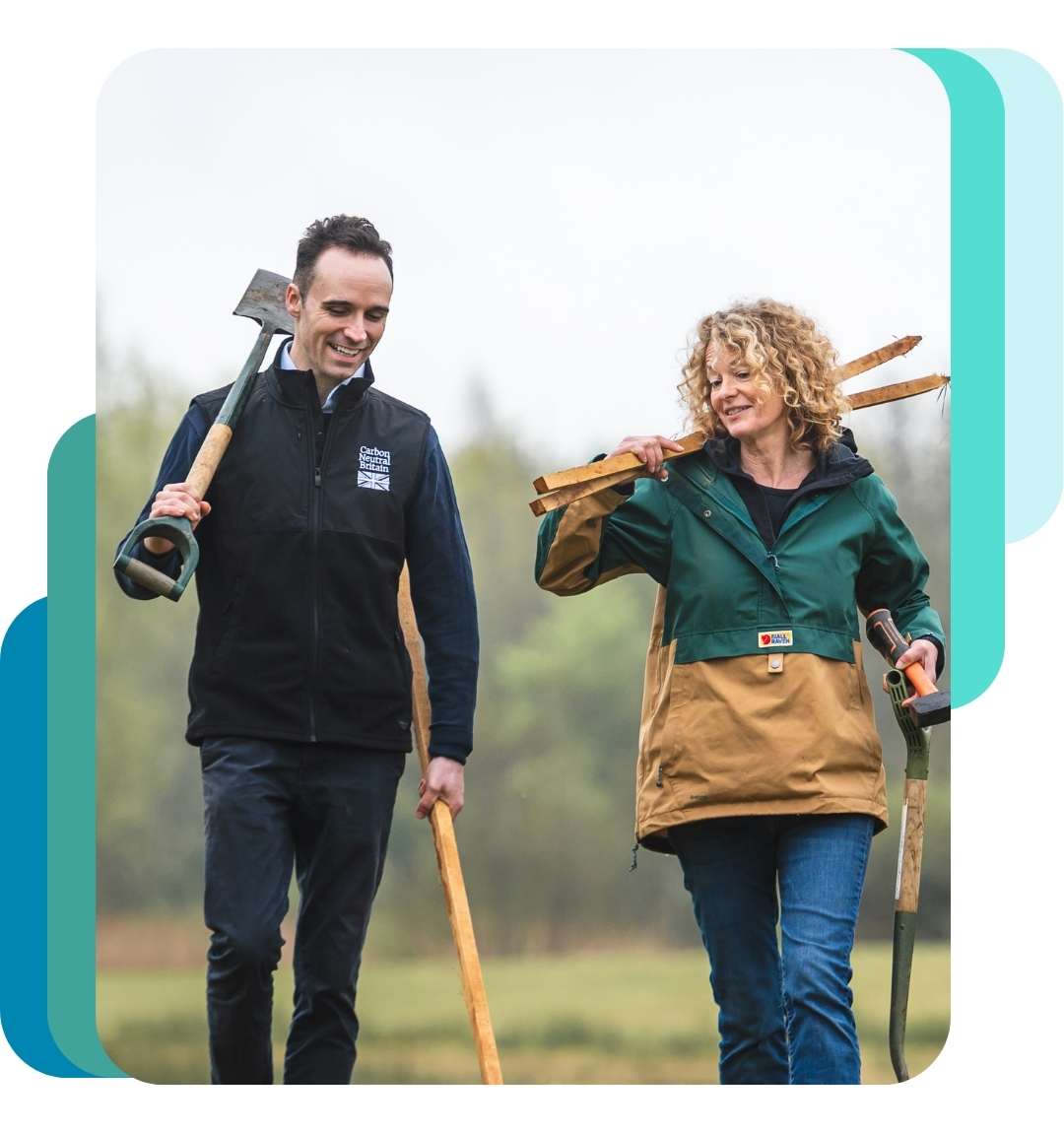 arbon Neutral Britain consultants walking outdoors with tree planting tools, representing certified carbon consulting and environmental action in the UK.